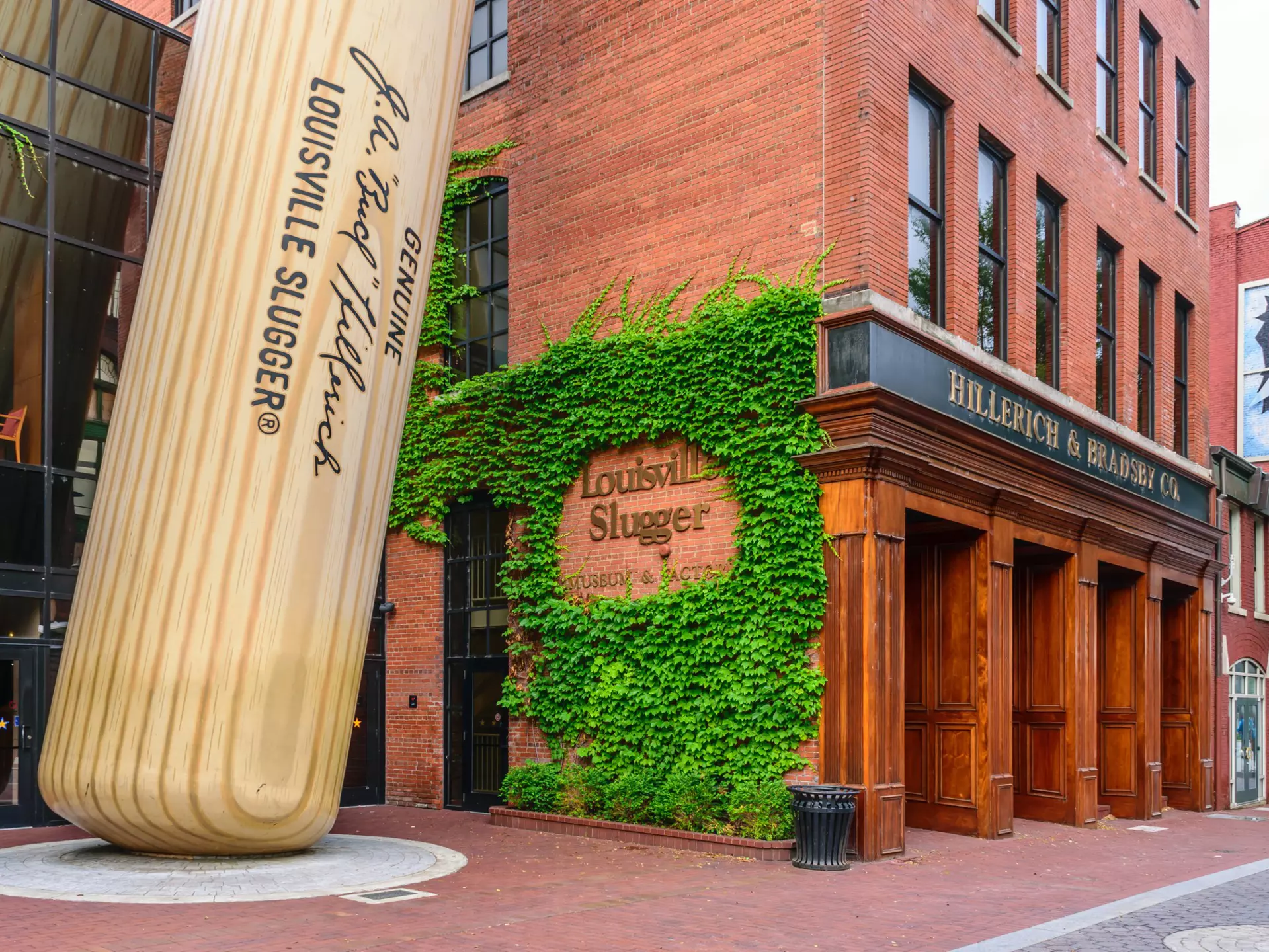 Exterior of the  Louisville Slugger Museum & Factory in downtown Louisville, Kentucky including a giant baseball bat propped up outside