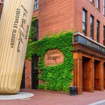 Exterior of the  Louisville Slugger Museum & Factory in downtown Louisville, Kentucky including a giant baseball bat propped up outside