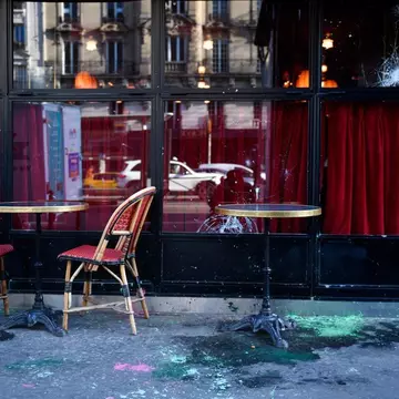 Paris has been gripped by strikes and demonstrations related to the recent, controversial pension reform.  Left Bank bistro La Rotonde was damaged on the 11th day of action © Julian de Rosa/AFP via Getty Images