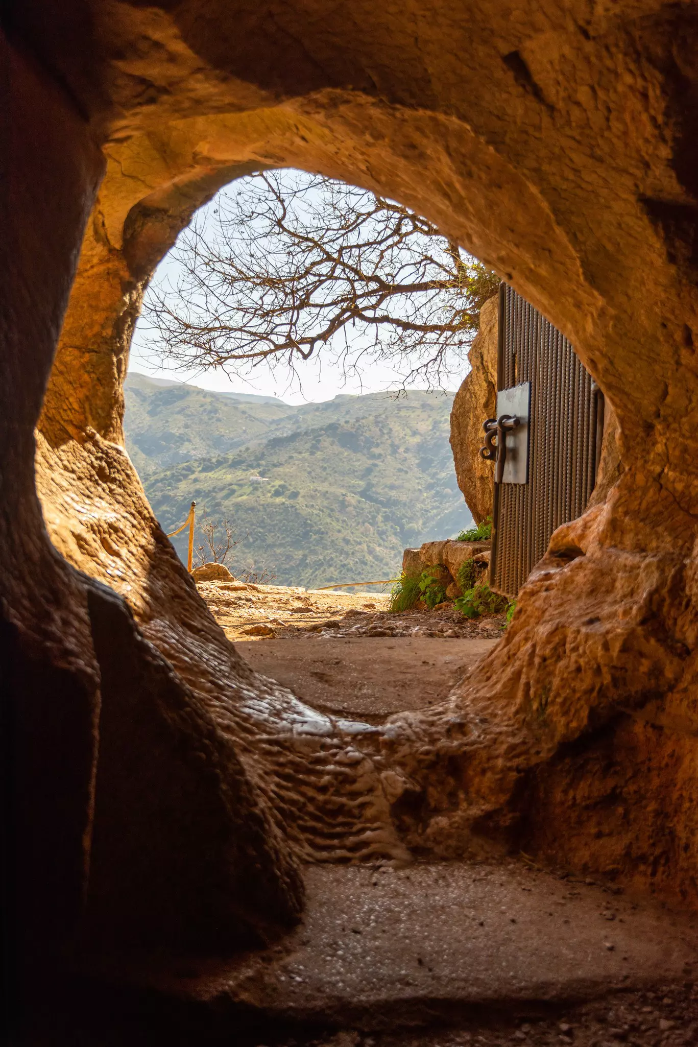 A circular hole marks the entrance to a cave.