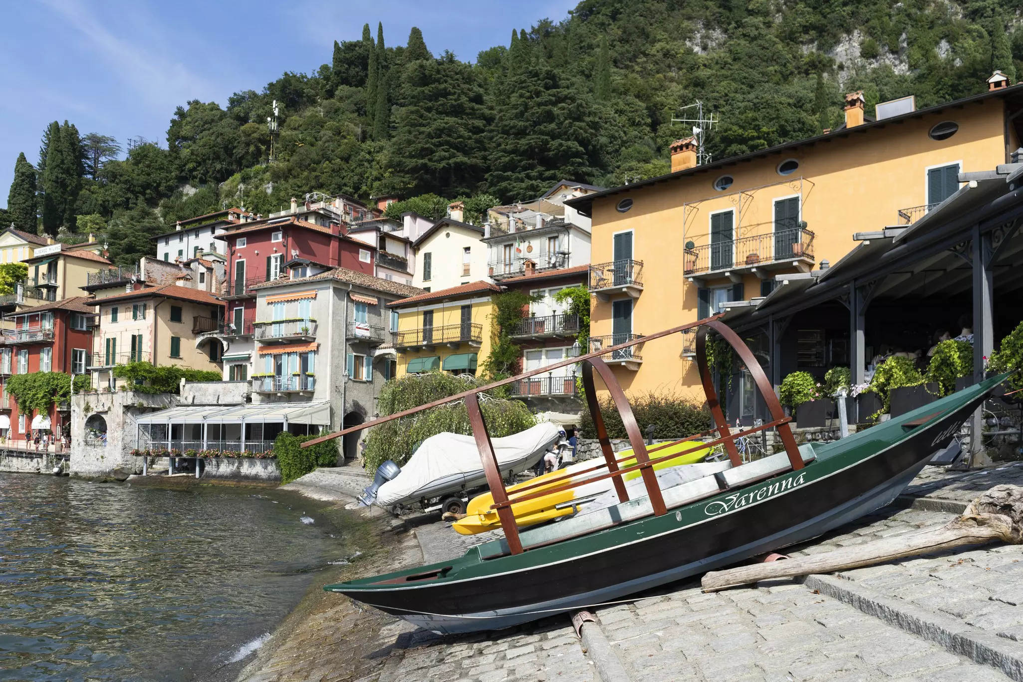 Boats docked on the shore in Riva Grande on Lake Como, Italy.
