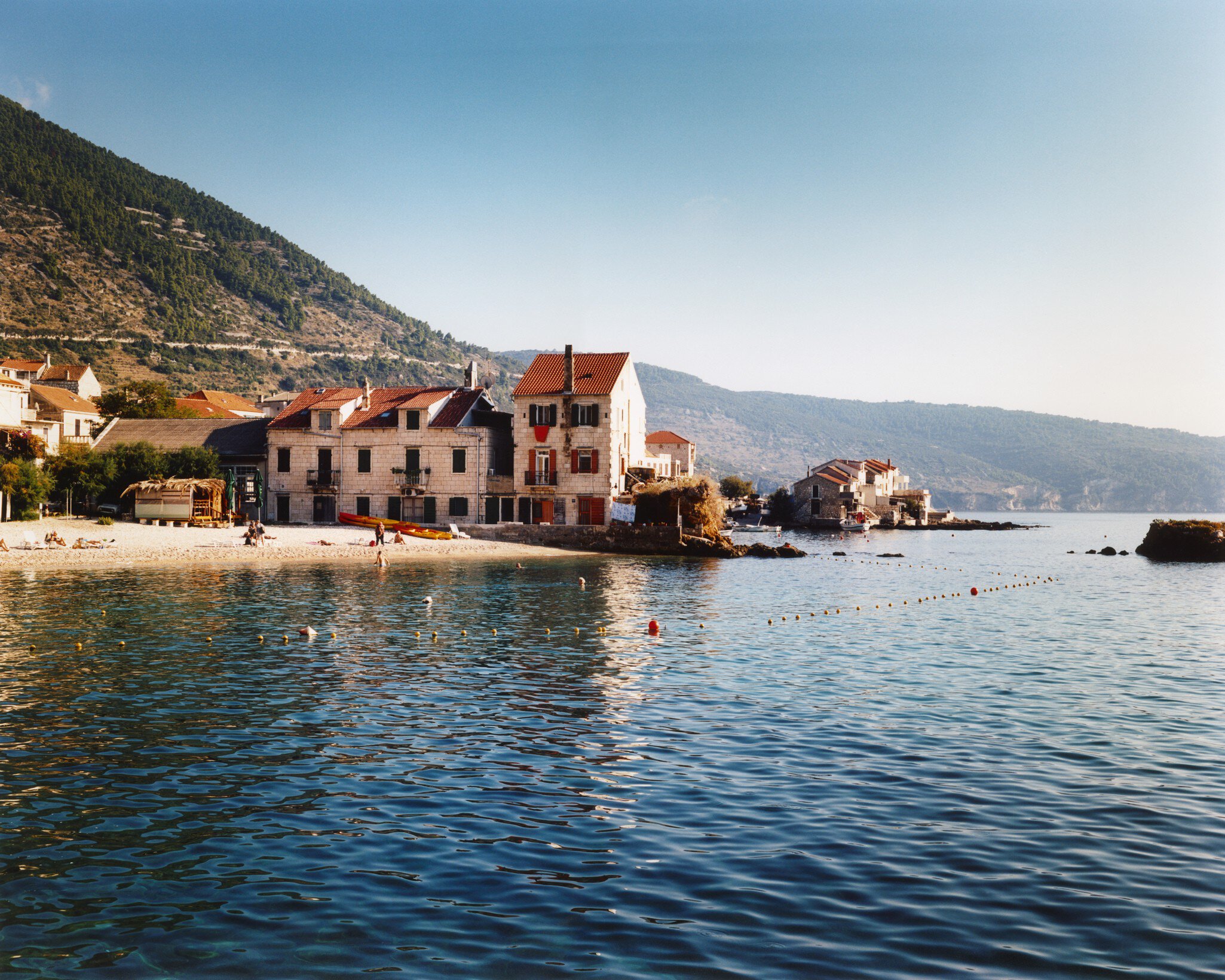 Komiza old town on coast at foot of Mount Hum.