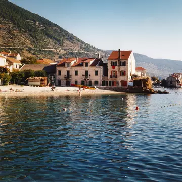 Komiza old town on coast at foot of Mount Hum.
