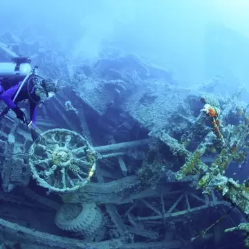 Scuba diver underwater at Million Dollar Point, Vanuatu