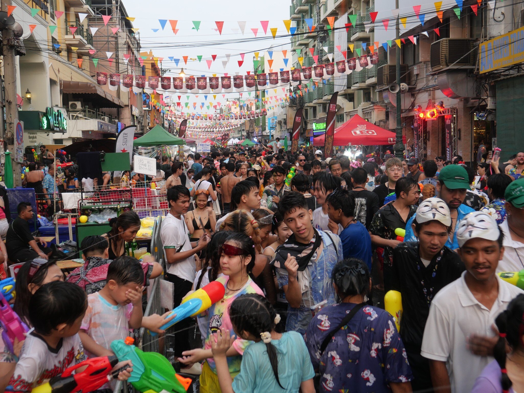 Bangkok, Thailand-April 13, 2023: Locals and tourists celebrate Songkran Festival, Traditional Thai New Year. People play water, and use water guns to enjoy the festival at Thanon Khao San, License Type: media, Download Time: 2026-06-10T14:54:14.000Z, User: LP_NZhan, Editorial: true, purchase_order: 65050 - Digital Destinations and Articles, job: App Content, client: Lonely Planet App, other: Nadine Zhan