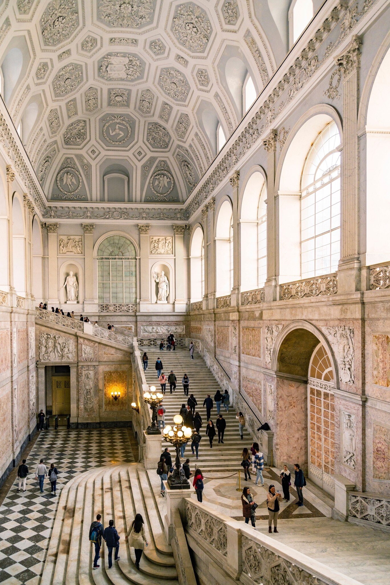 View of the baroque and neoclassic interior of the Palazzo Reale in Naples, Italy.