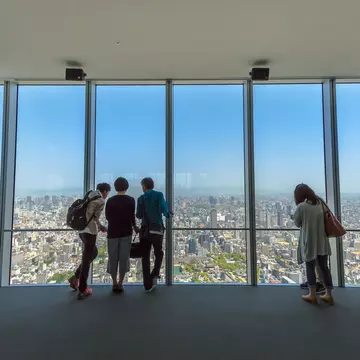 Osaka, Japan - April 30, 2017: tourists looking Osaka city at Abeno Harukas, the tallest skyscraper in Japan. The building stands on top of Kintetsu Osaka Abenobashi Station near JR Tennoji Station.