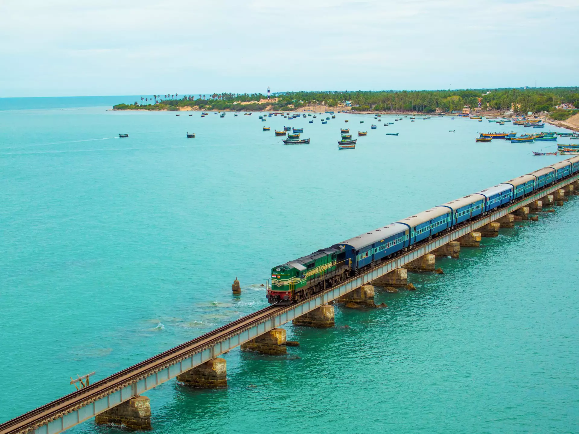 A train crossing the Pamban Bridge in Tamil Nadu, India. Veerababu Achanta/Shutterstock