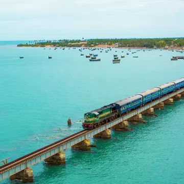 A train crossing the Pamban Bridge in Tamil Nadu, India. Veerababu Achanta/Shutterstock