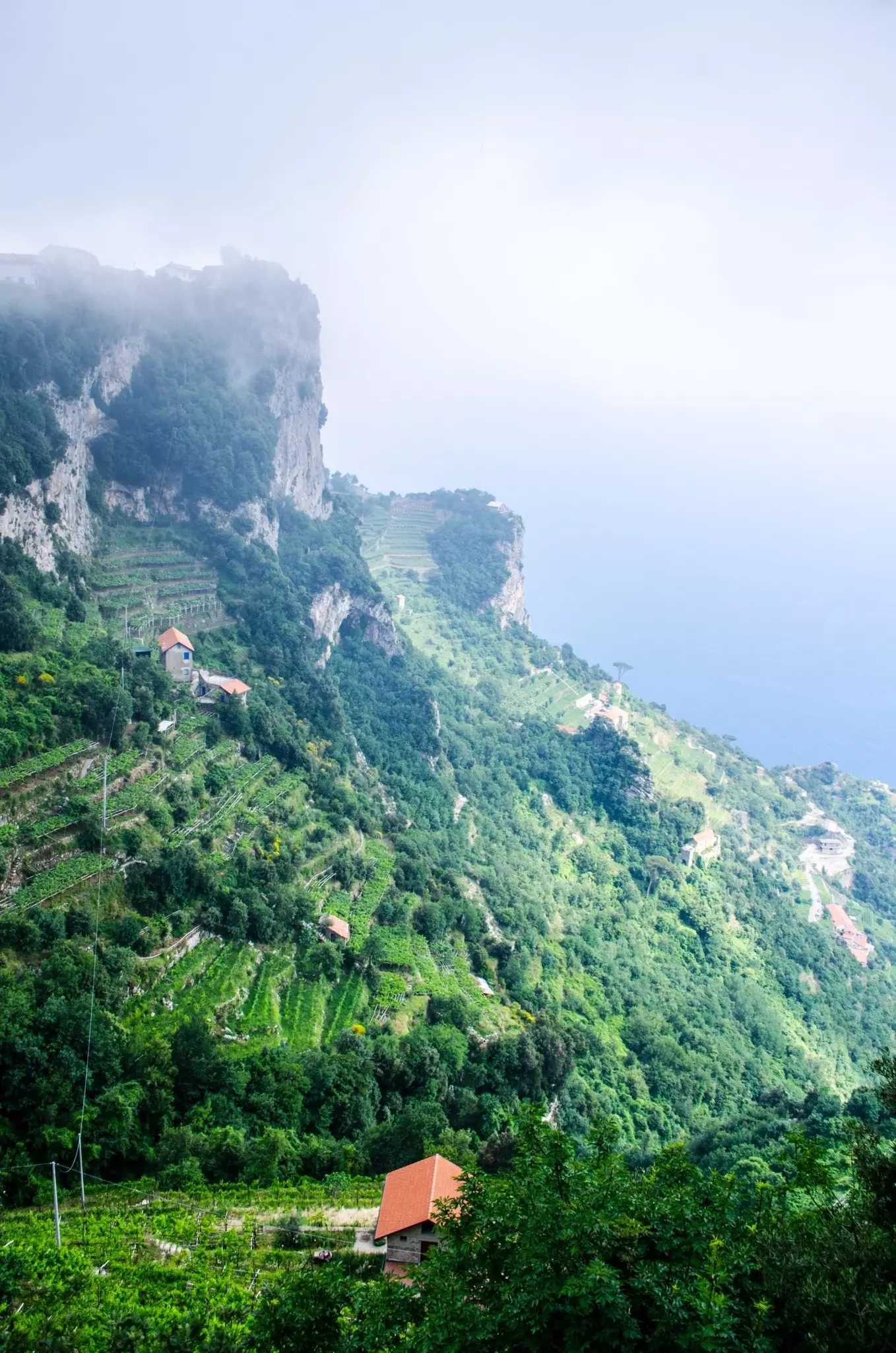 A picture taken on a seaside trail in Campania during a foggy day