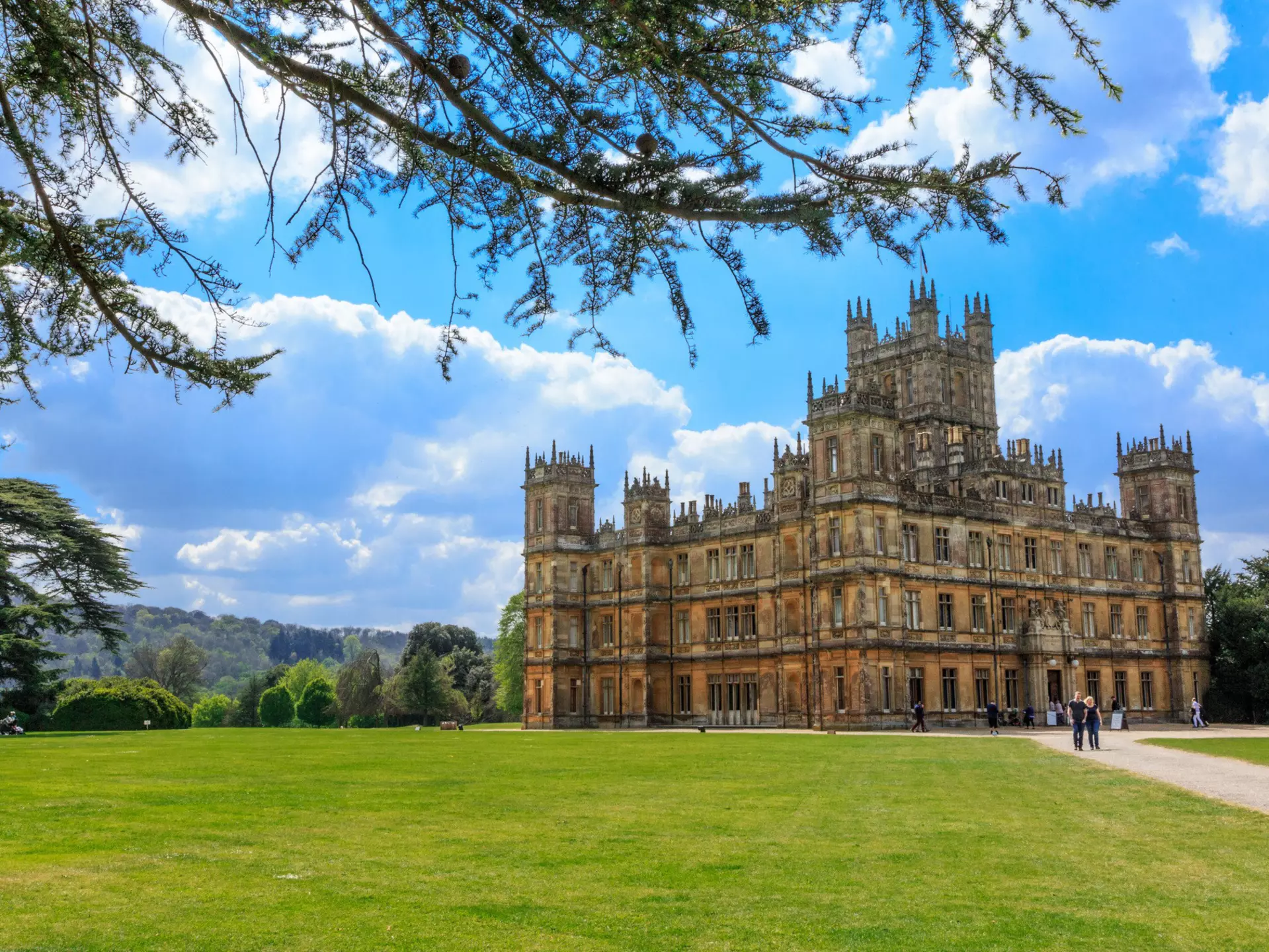 Exterior of Highclere Castle on a sunny day. Emily Marie Wilson/Shutterstock