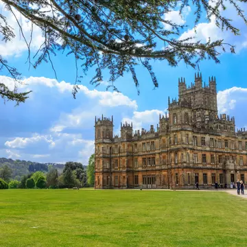 Exterior of Highclere Castle on a sunny day. Emily Marie Wilson/Shutterstock