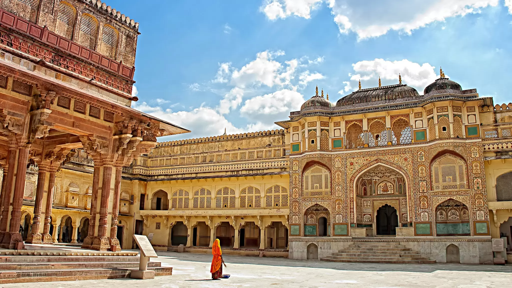 A woman in a sari in the courtyard of Amber Fort in Jaipur, India.