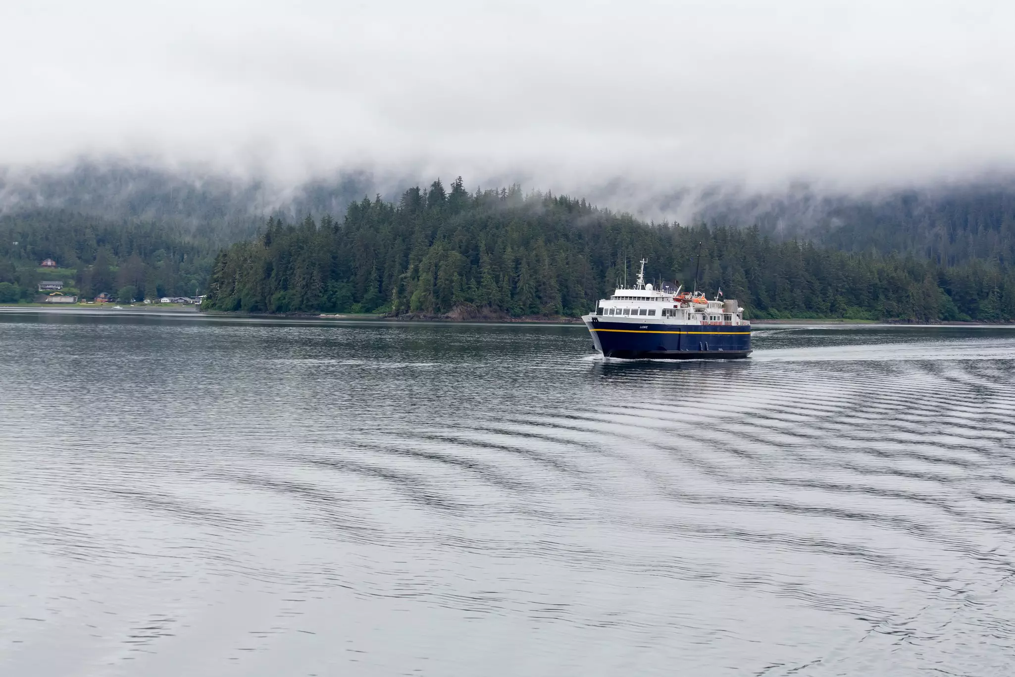 An Alaska Marine Highway System ferry sailing across a harbor.