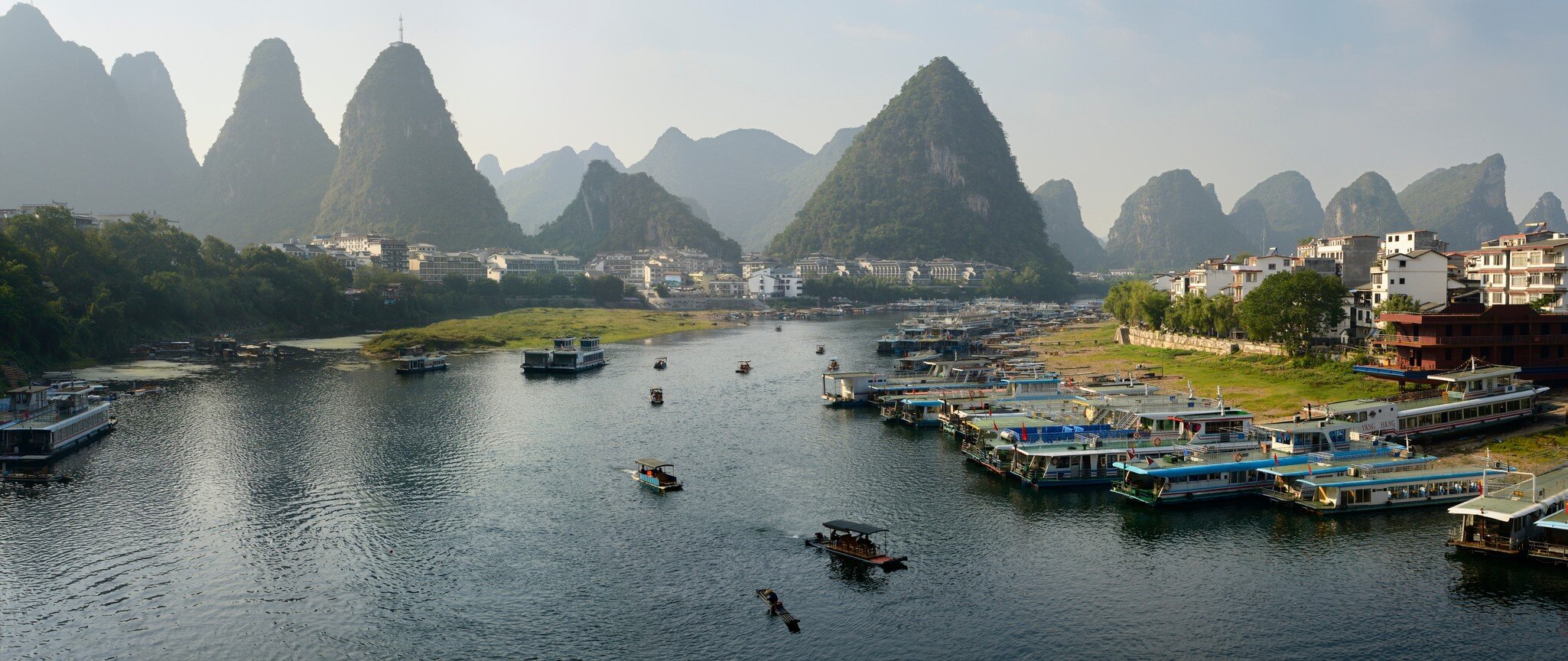 Green Lotus Peak overlooking Yangshuo town harbour on the Li Jiang river Yangshuo, Guangxi, People's Republic of China - October 10, 2011, License Type: media, Download Time: 2026-09-02T15:50:23.000Z, User: LP_NZhan, Editorial: true, purchase_order: 65050 - Digital Destinations and Articles, job: App Content, client: Lonely Planet App, other: Nadine Zhan