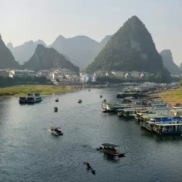 Green Lotus Peak overlooking Yangshuo town harbour on the Li Jiang river Yangshuo, Guangxi, People's Republic of China - October 10, 2011, License Type: media, Download Time: 2026-09-02T15:50:23.000Z, User: LP_NZhan, Editorial: true, purchase_order: 65050 - Digital Destinations and Articles, job: App Content, client: Lonely Planet App, other: Nadine Zhan