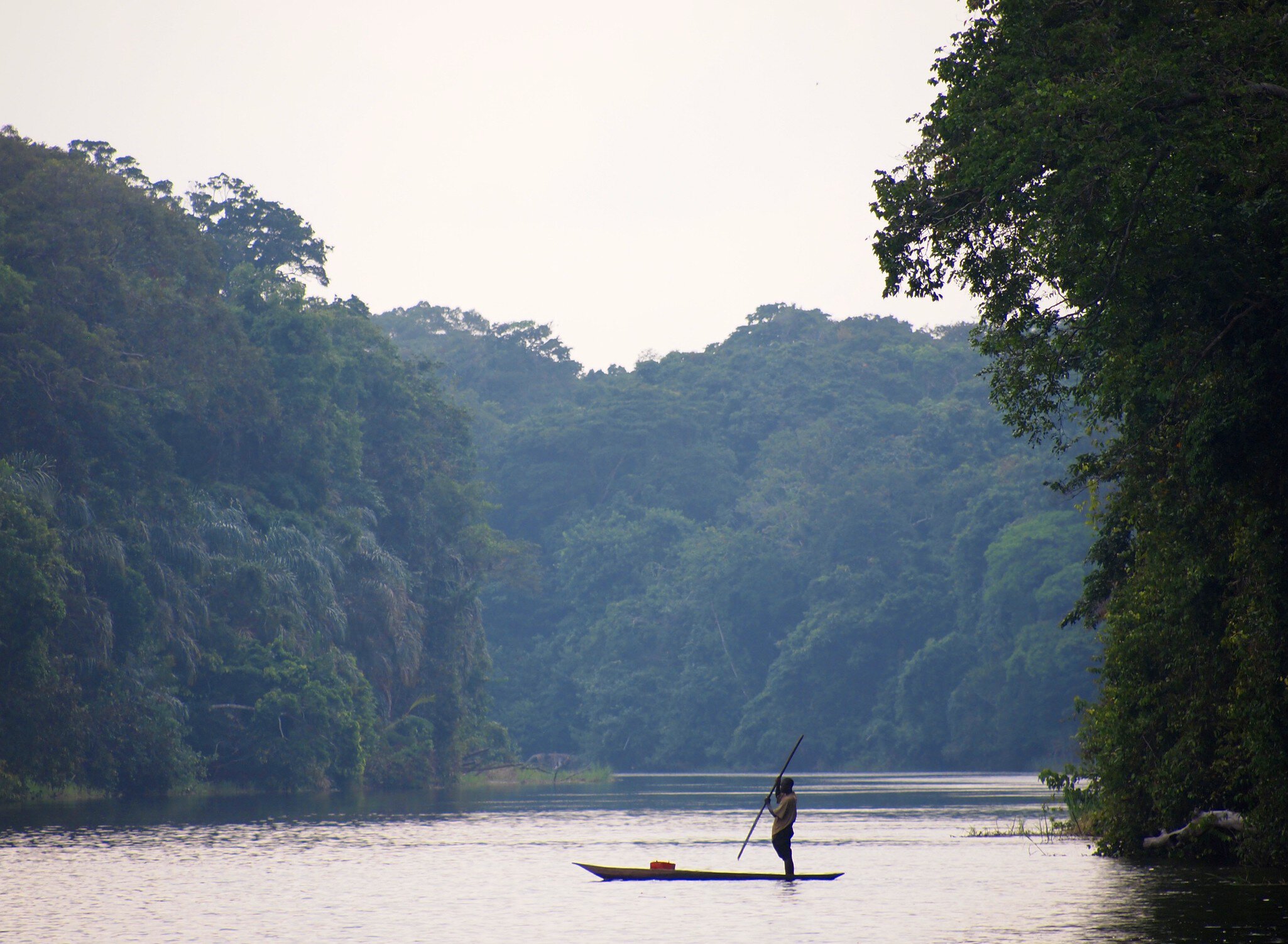 Fisherman in dugout canoe, Congo.