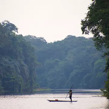 Fisherman in dugout canoe, Congo.
