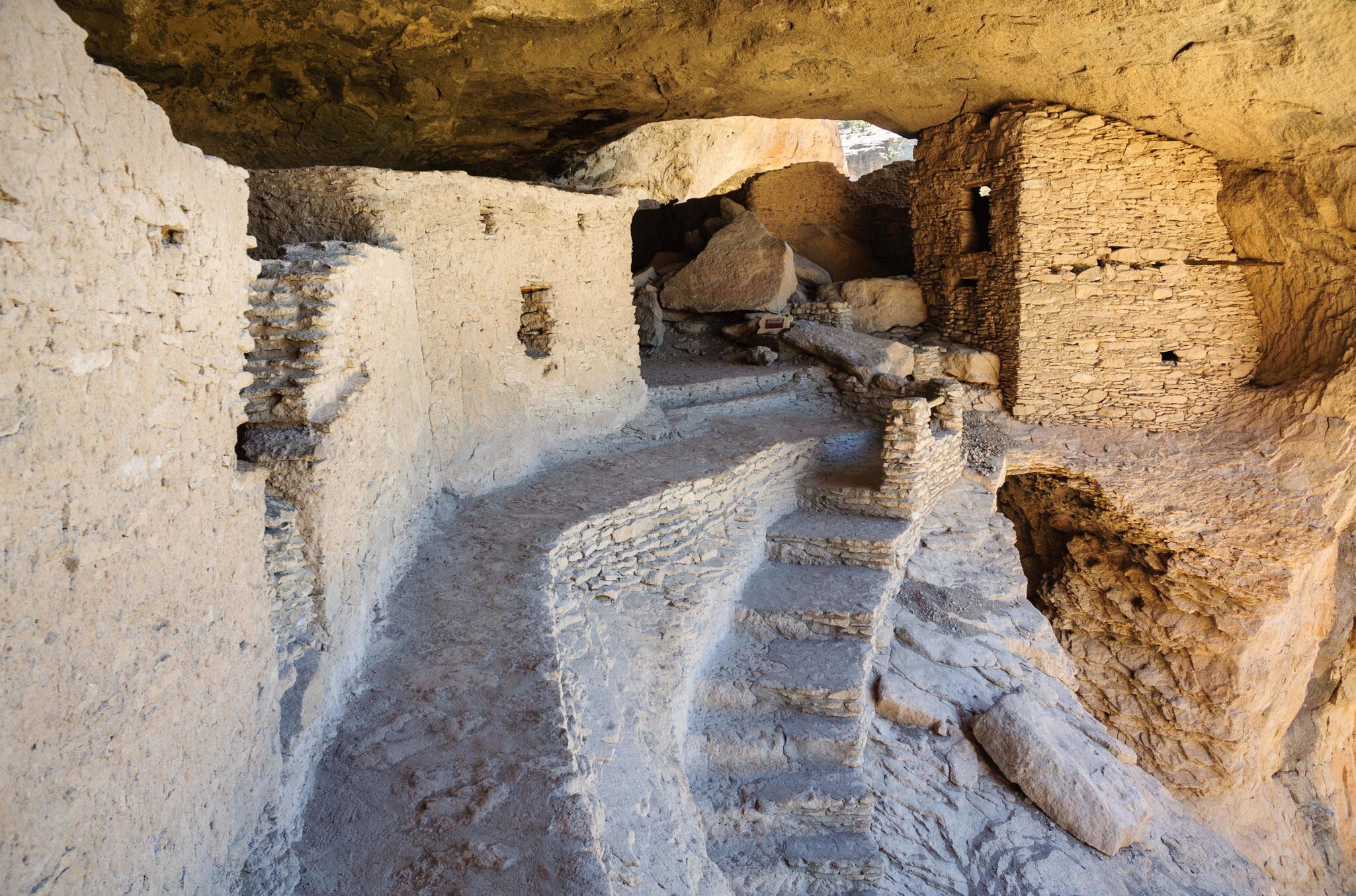 A path leads to a cliffside ruin in Gila Cliff Dwellings National Monument