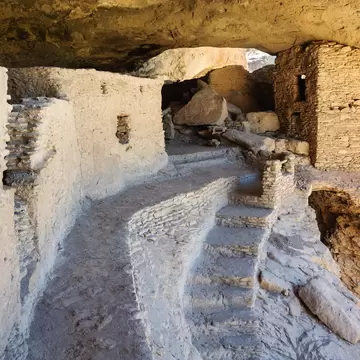 A path leads to a cliffside ruin in Gila Cliff Dwellings National Monument