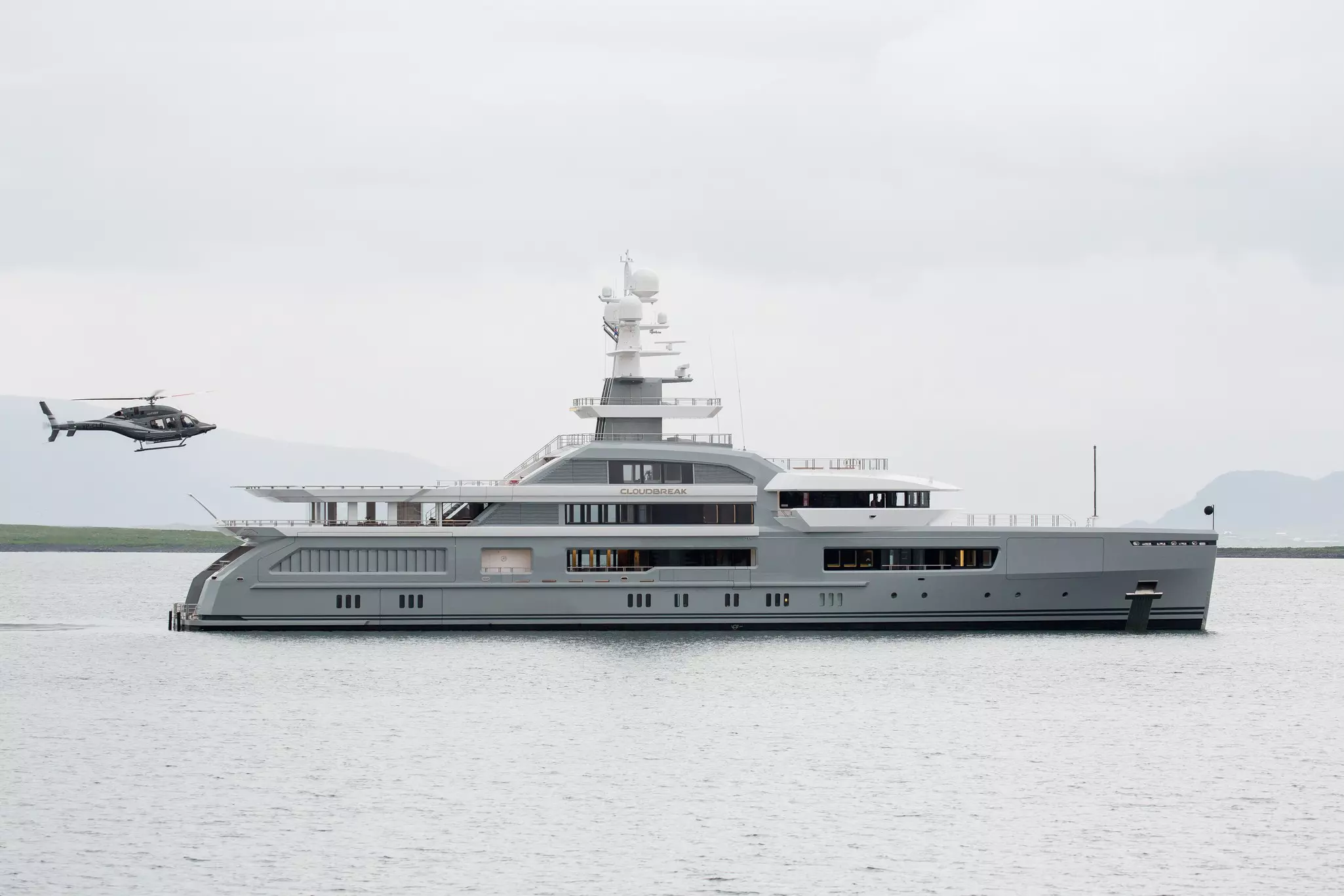 A helicopter attempts to land on the luxurious yacht Cloudbreak near Reykjavik.