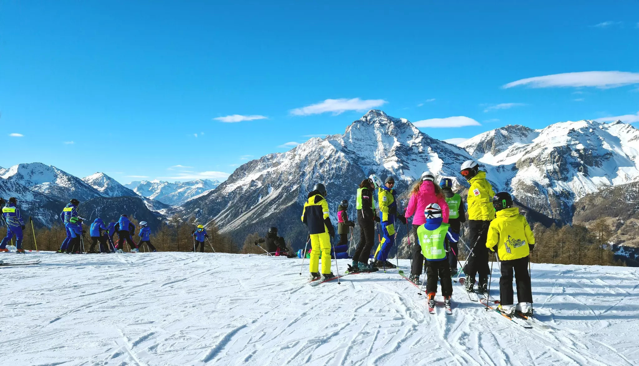 People on a ski slope in the Via Lattea ski area