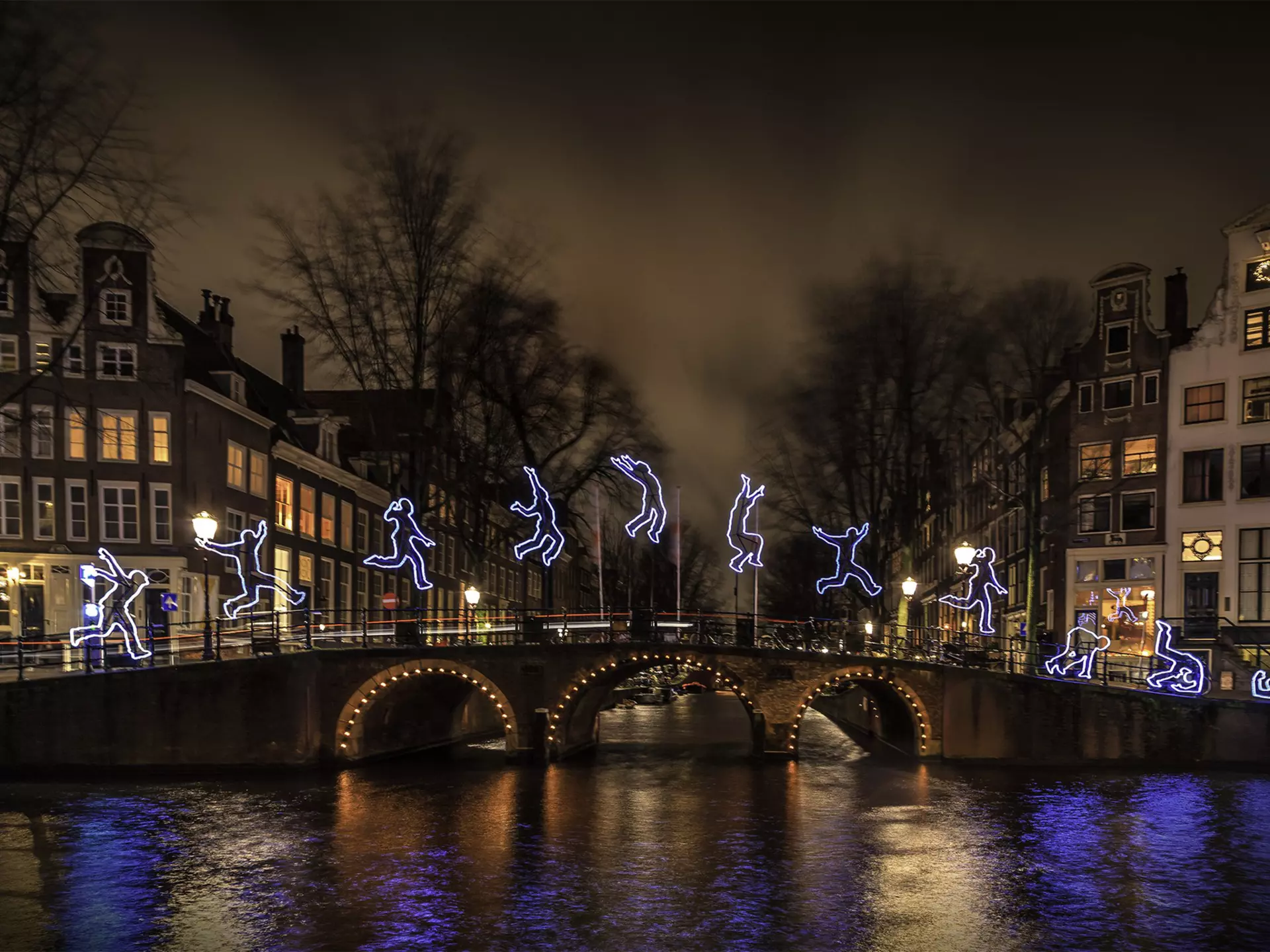 A canal bridge lit up for the Amsterdam Light Festival