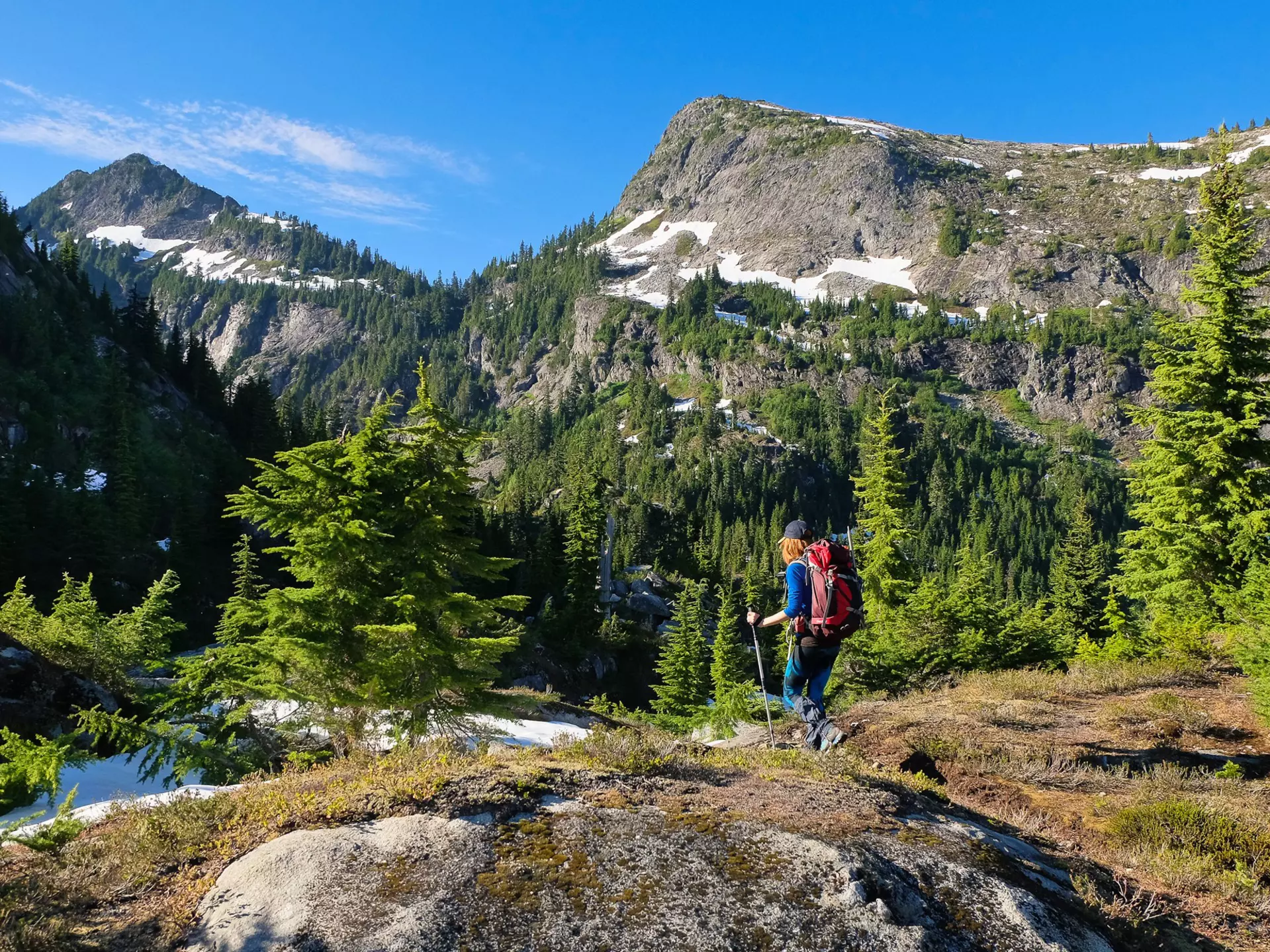 A Woman Hiker Among Stunning Peaks and Forest. North Cascades National Park, Washington, License Type: media, Download Time: 2025-09-16T17:29:21.000Z, User: meg3348277, Editorial: false, purchase_order: 56530 - Guidebooks, job: Global Publishing-WIP, client: Lonely Planet 'USA 13', other: Megan Cassidy