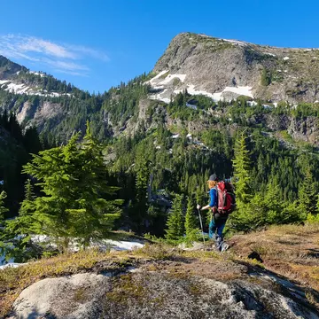 A Woman Hiker Among Stunning Peaks and Forest. North Cascades National Park, Washington, License Type: media, Download Time: 2025-09-16T17:29:21.000Z, User: meg3348277, Editorial: false, purchase_order: 56530 - Guidebooks, job: Global Publishing-WIP, client: Lonely Planet 'USA 13', other: Megan Cassidy