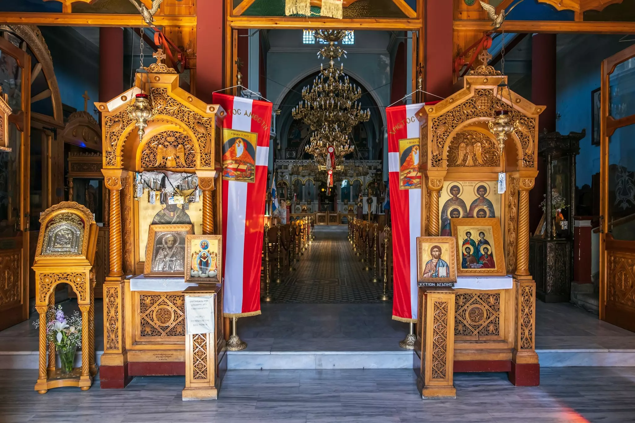 Two altars display icons at the entrance to a church.