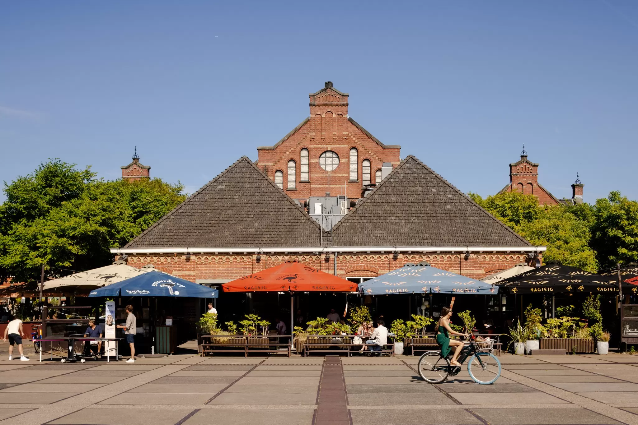 View of the brick buildings of Cultural Park Westergas in Amsterdam, Netherlands, on a sunny day.
