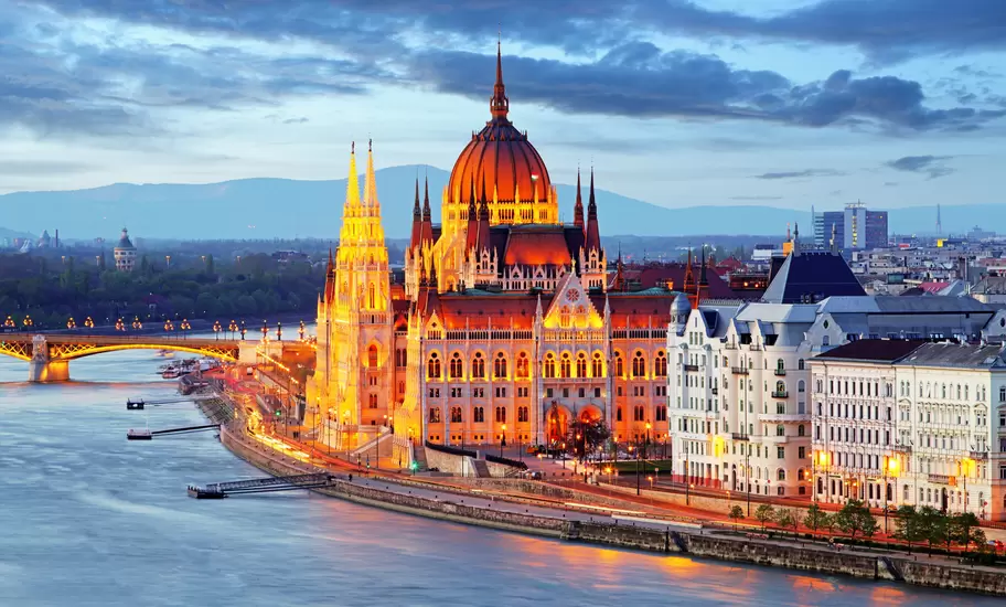 Hungarian Parliament Building illuminated at night.