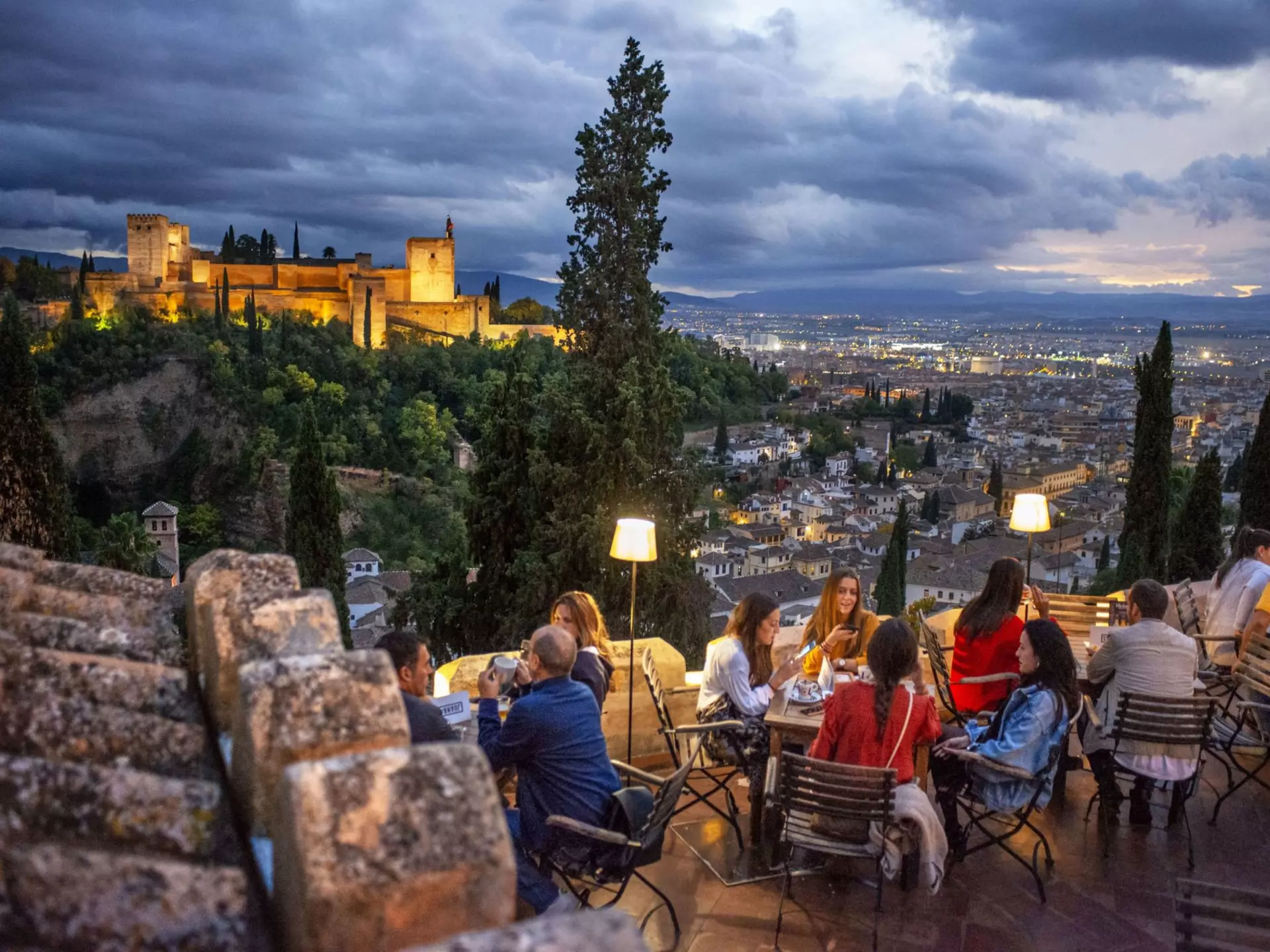 Experience sunset in Granada overlooking the illuminated Alhambra palace. Sergi Reboredo/VWPics/Universal Images Group/Getty Images
