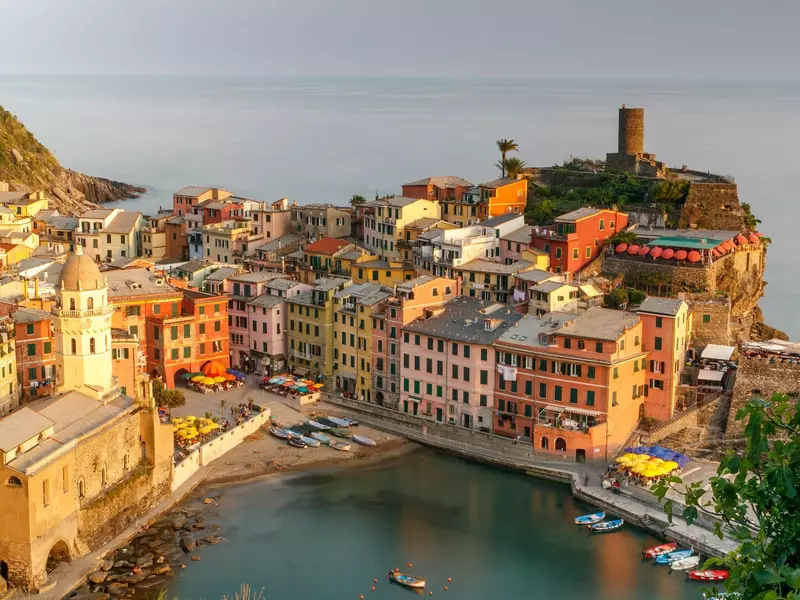 Aerial view of a Cinque Terre town with typical pastel buildings overlooking the sea