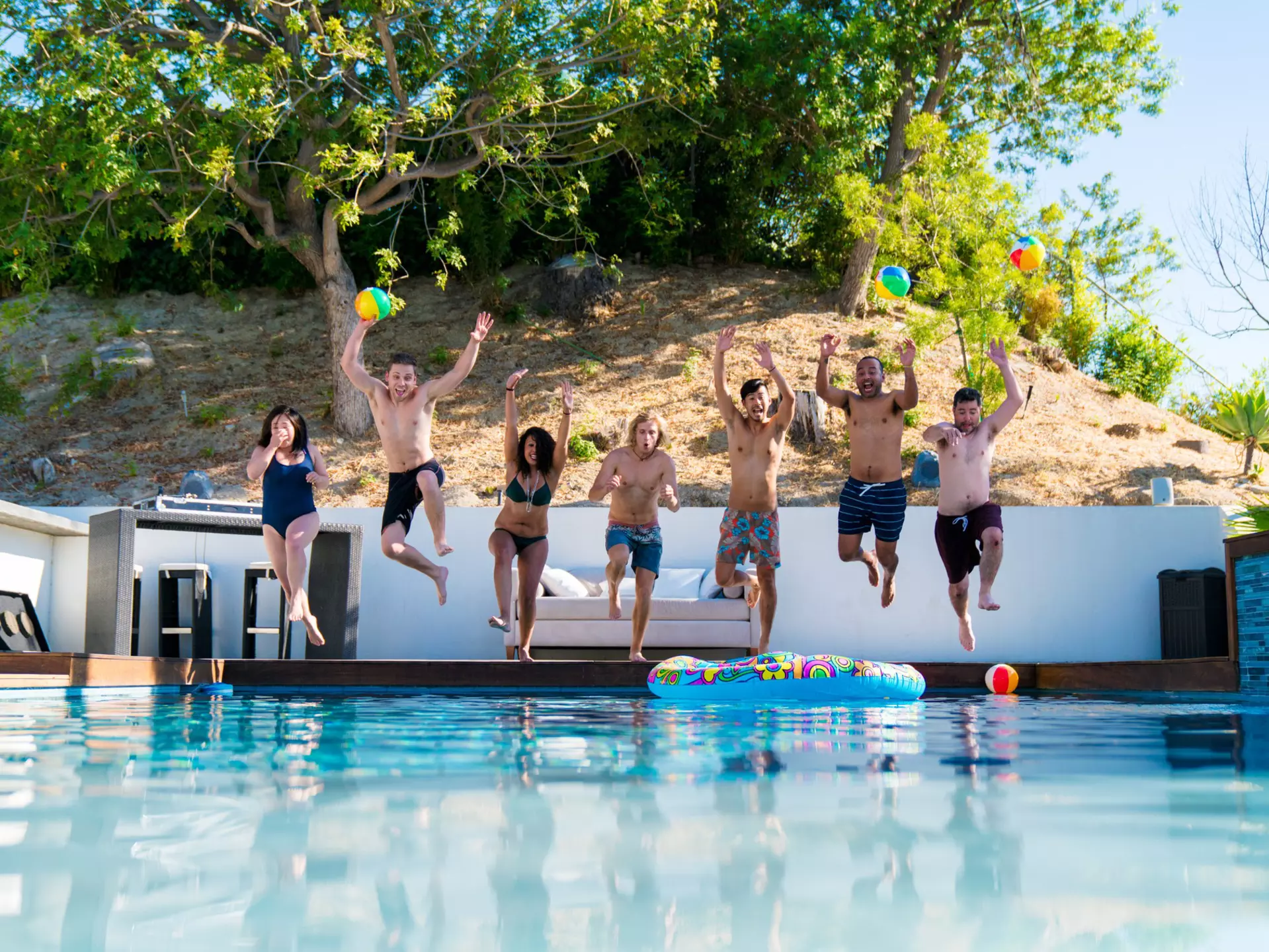 July 2017: Group of friends jumping into a swimming pool in Los Angeles on a summer day.
873818264
Young Adult, Heat - Temperature, Travel Destinations, Horizontal, Fun, Wellbeing, Party - Social Event, Togetherness, California, Friendship, Domestic Life, Idyllic, Enjoyment, 20-29 Years, Swimwear, Happiness, Summer, Cool Attitude, Vacations, Sunbathing, Bonding, Travel, Small Group Of People, Tranquility, 30-39 Years, People, Real People, Adults Only, Freedom, Jumping, Playful, Lifestyles, Water, Relaxation, Motion, Hotel, Youth Culture, Swimming Pool, Pool Party, Tourist Resort, Group Of People, Photography, Swimming, Leisure Activity, Mixed Race Person, Weekend Activities, Multi-Ethnic Group, USA, Vitality, Body Positive, Inflatable, Holiday Villa