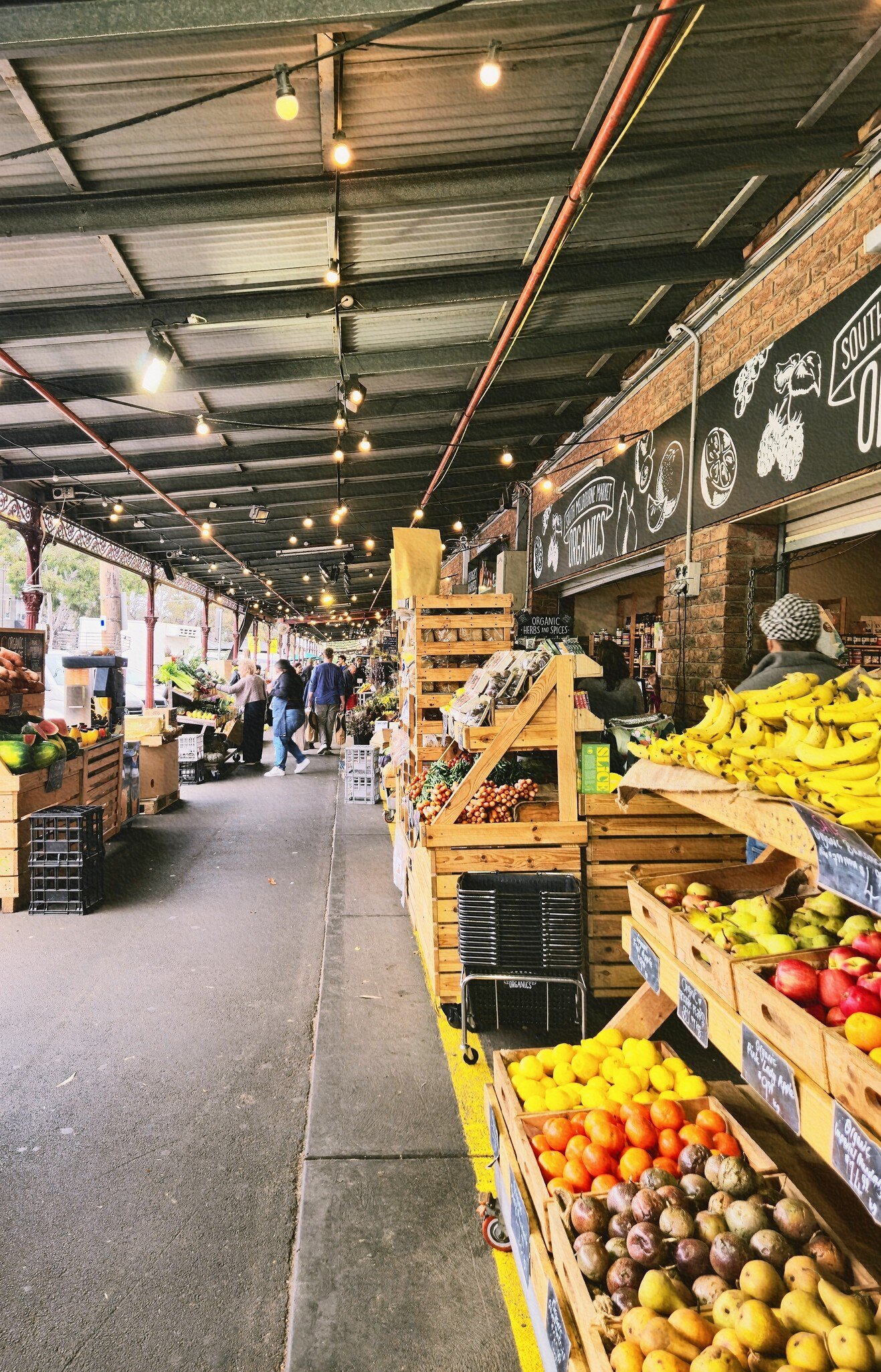 Fruit vendors at South Melbourne market. Melbourne, Australia.
