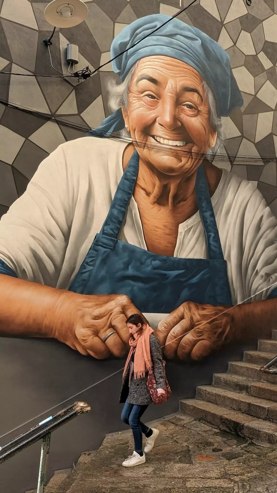 A large mural depicts Woody Guthrie and the phrase 'This land is your land' on the side of the center. USA museums for music lovers