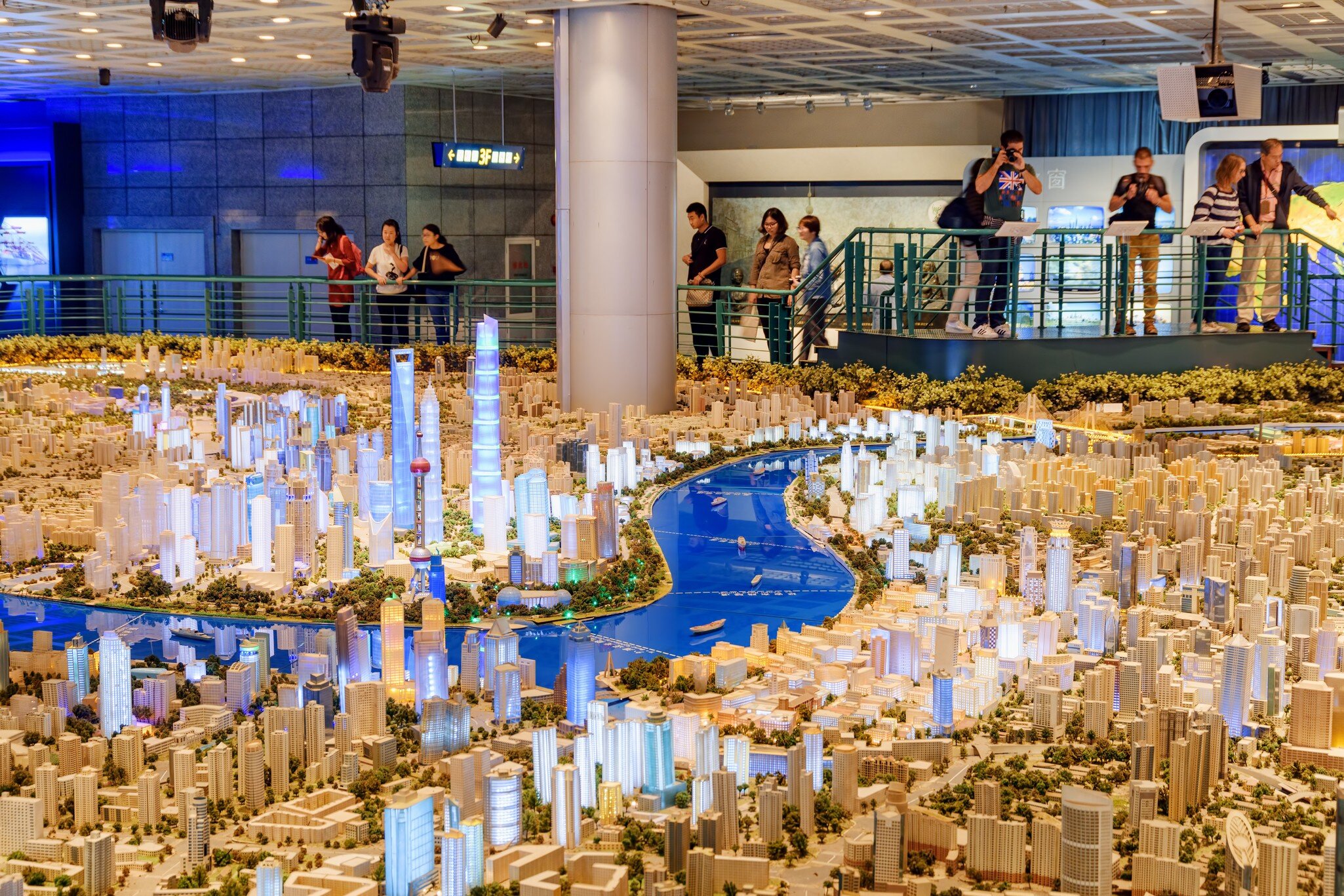 Shanghai, China - October 3, 2017: Tourists taking pictures of a large scale model of the city in the Shanghai Urban Planning Exhibition Center. The model showing all existing and approved buildings., License Type: media, Download Time: 2025-03-10T19:52:09.000Z, User: dermothegarty77, Editorial: true, purchase_order: 56530 - Guidebooks, job: Global Publishing WIP, client: China 17, other: Dermot Hegarty