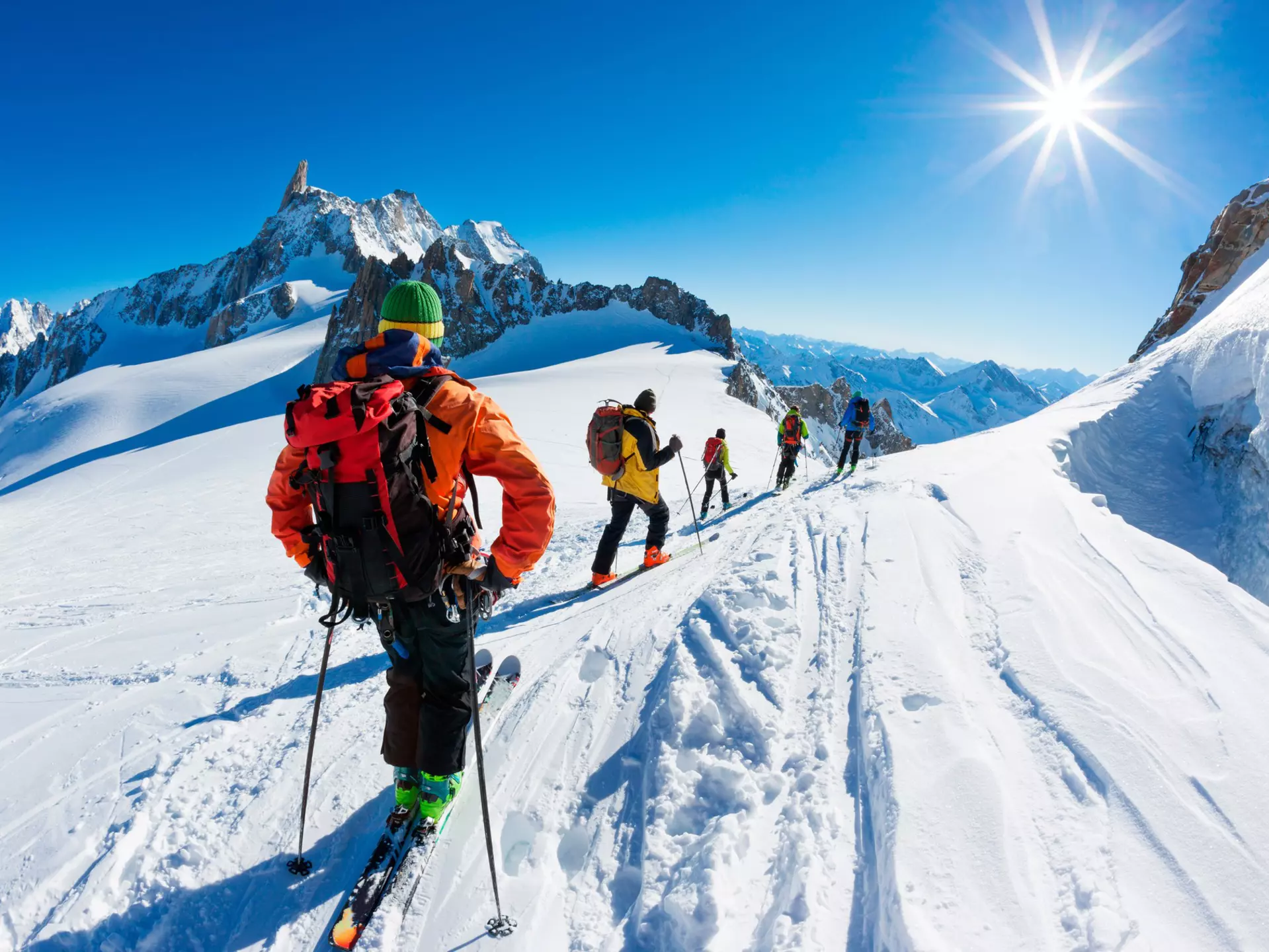Skiers beginning the descent of the Vallée Blanche, French Alps. Roberto Caucino/Shutterstock