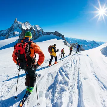 Skiers beginning the descent of the Vallée Blanche, French Alps. Roberto Caucino/Shutterstock