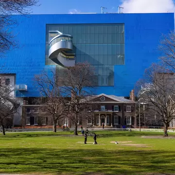 Exterior of the Art Gallery of Ontario with a Victorian mansion and a controversial modern addition by architect Frank Gehry.
