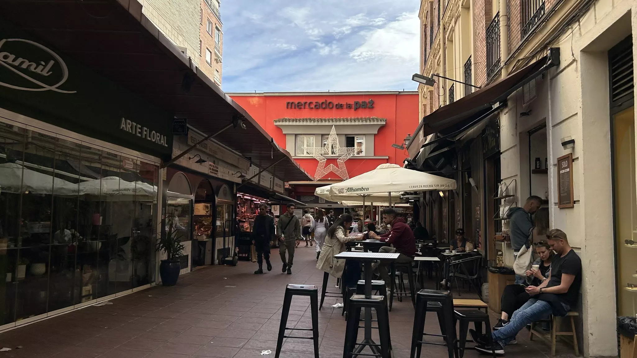 A promenade leading up to the entrance of a market