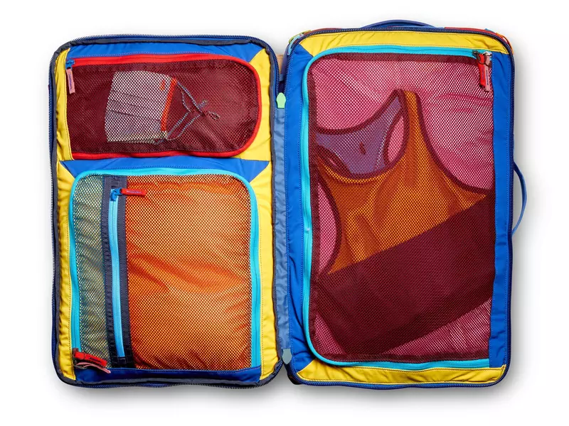 Multicolored mesh pockets in an opened bag.