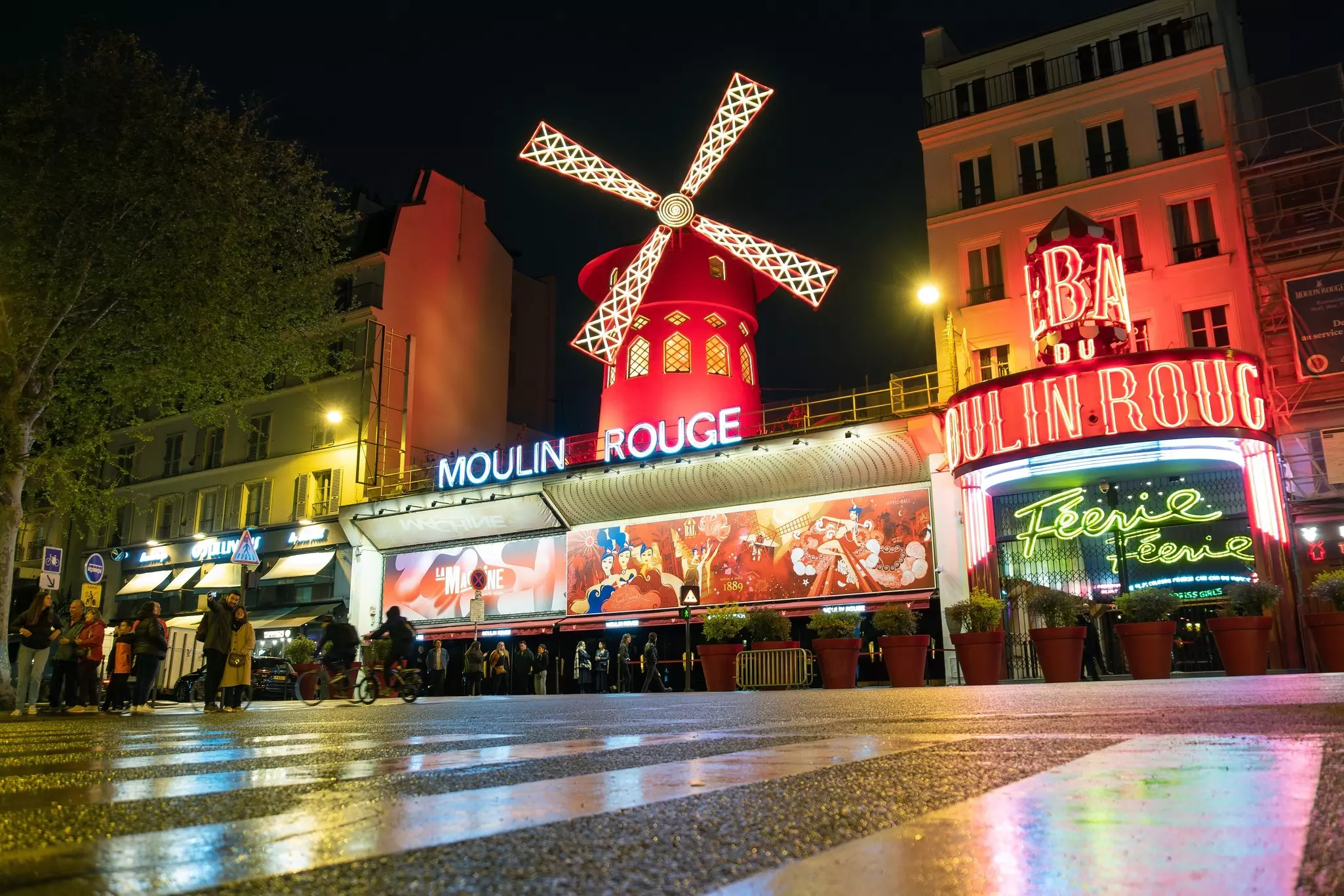 Paris, France - April 24 2023: the exterior of Parisian Moulin Rouge at night in Paris, France. The Moulin Rouge is the most famous cabaret venue in France  License Type: media  Download Time: 2023-11-04T15:13:26.000Z  User: Norma.PrauseBrewer_LonelyPlanet  Is Editorial: Yes  purchase_order:   