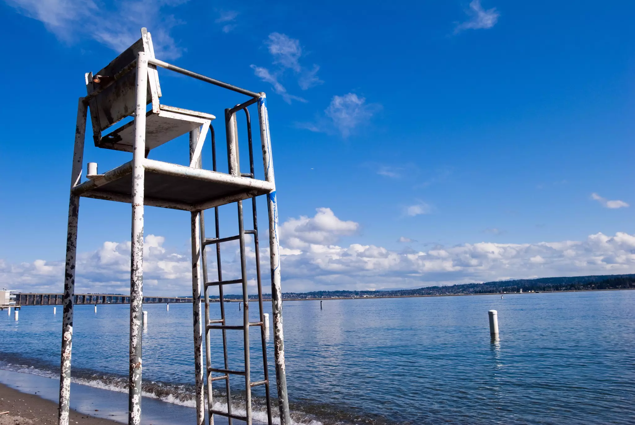 Lifeguard chair at Madison Park in Seattle, WA with Lake Washington in the background. ©Gregory Olsen/Getty Images