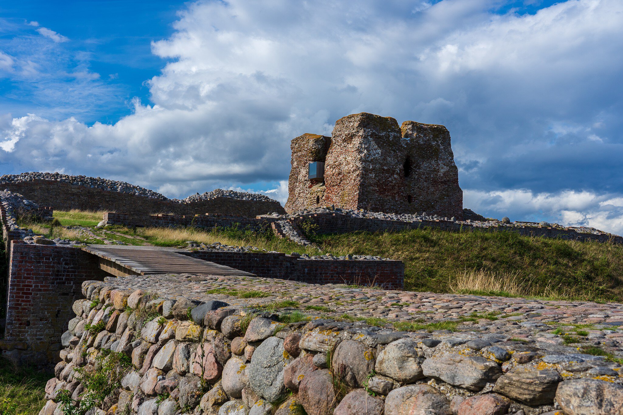 Rønde, Denmark: 08 14 2019: The remains of the historic danish fortress known as "Kalø Slotsruin" from the bridge leading to the old entrance with the big tower still standing tall.; Shutterstock ID 1657073812;