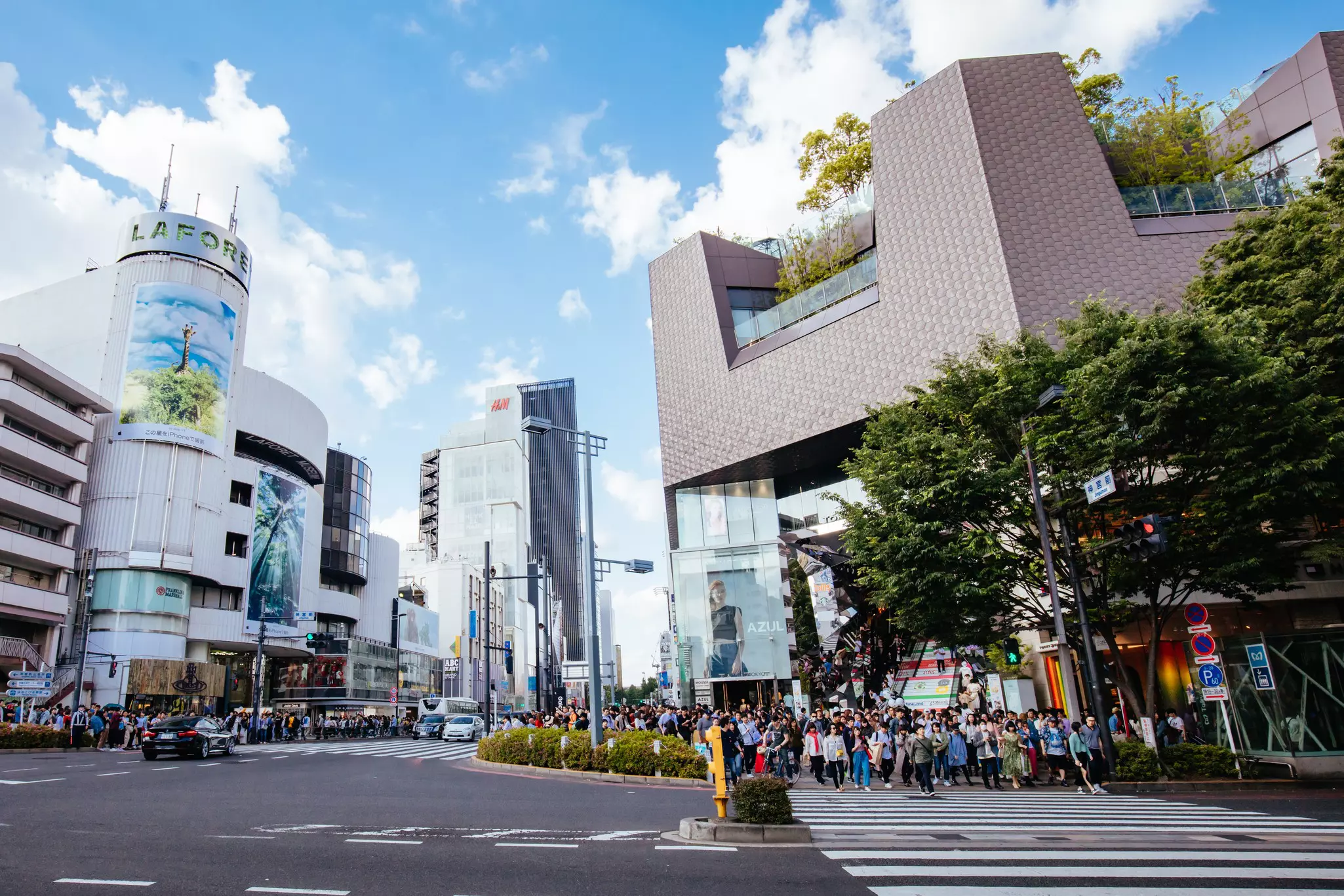 The busy intersection of Meiji-jingumae Station at Meiji-Dori and Omote-sando streets in Harajuku in central Tokyo, Japan.