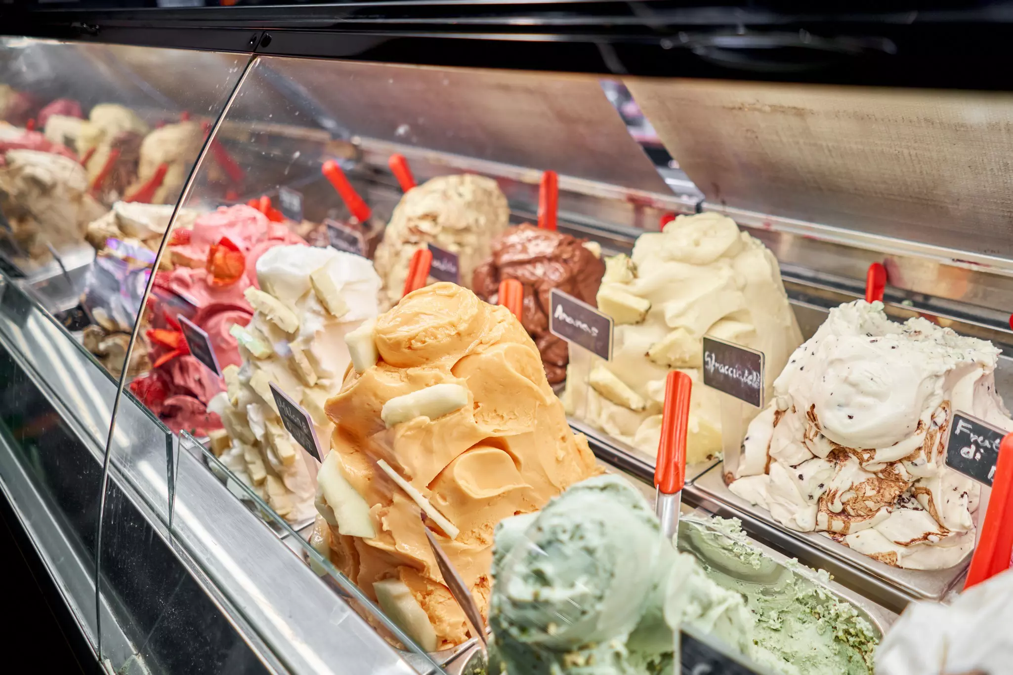 Gelato generally contains less fat than ice cream, resulting in a distinctively creamy, utterly irresistible density. Fusionstudio/Shutterstock