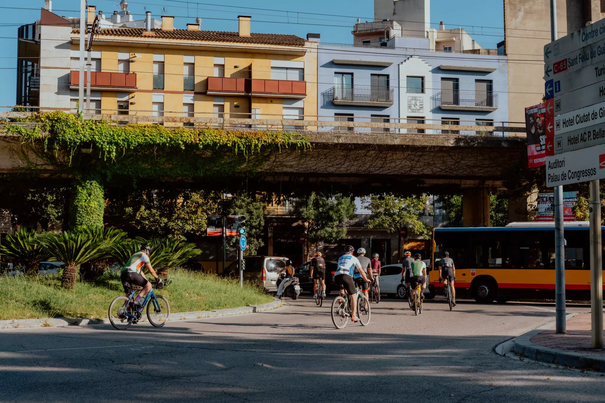 Cyclists and a bus share the road in Barcelona. 