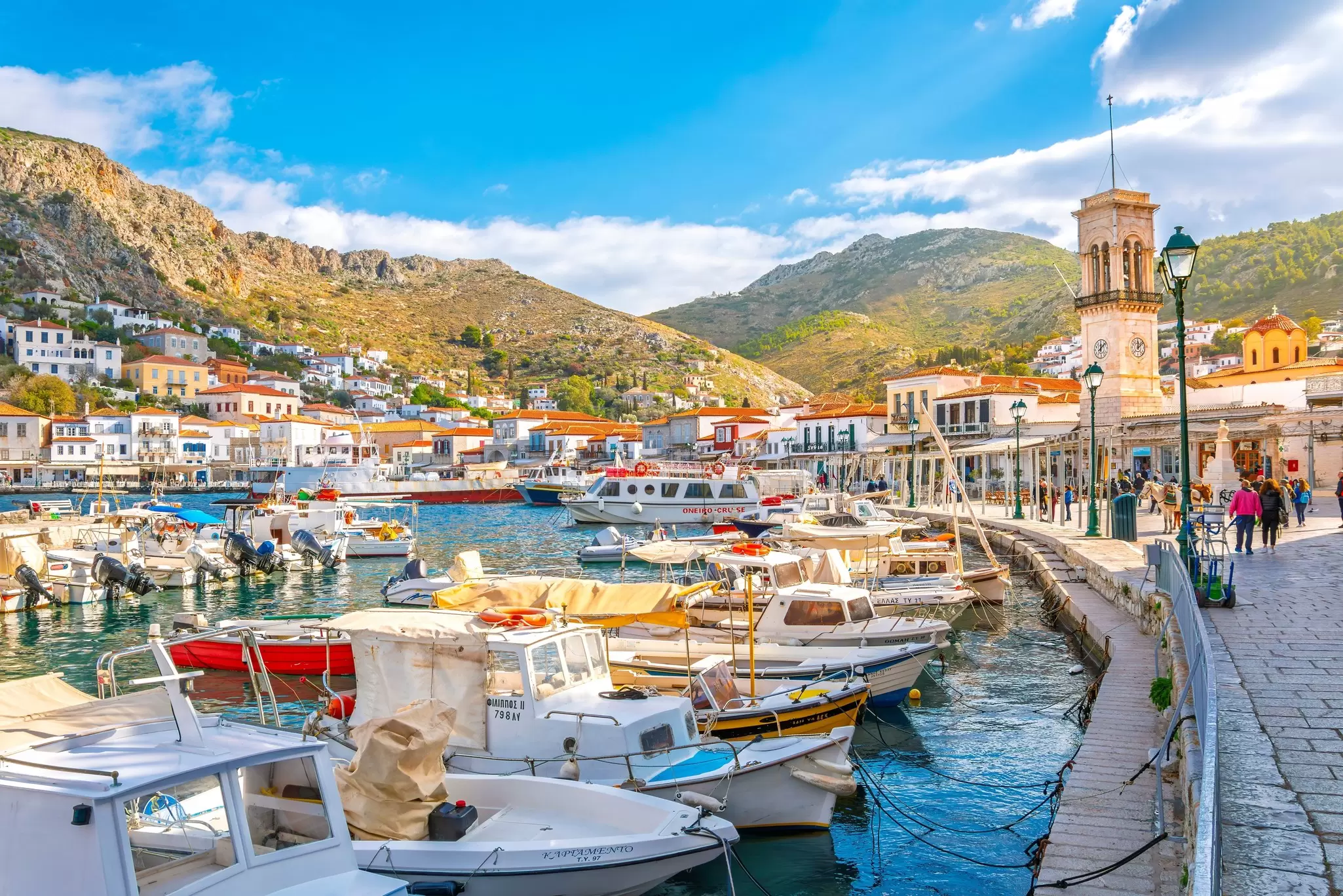 View of boats in the harbor and port of the Greek waterfront village of Hydra.